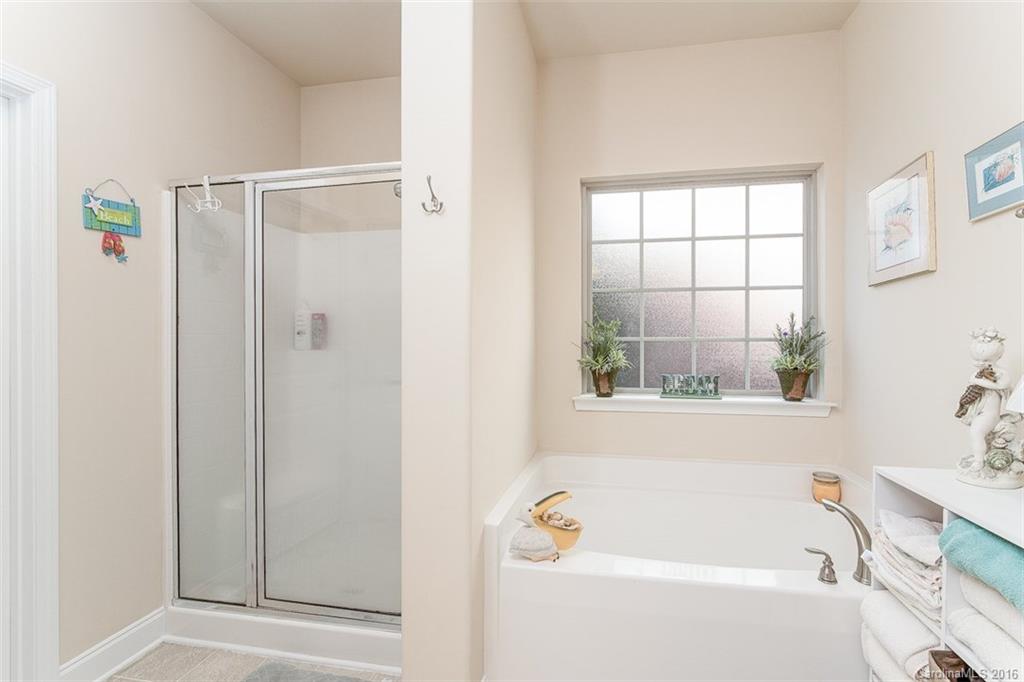 1752 Newland Road Denver, NC 28037 - Photo 8 of 15 a bathroom with a bathtub and a shower