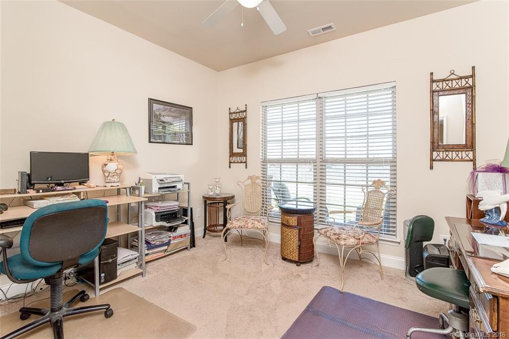 1752 Newland Road Denver, NC 28037 - Photo 10 of 15 a view of a livingroom with workspace and a window