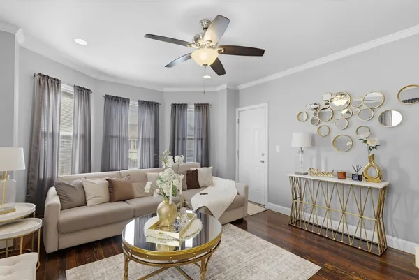 a living room with furniture and a window