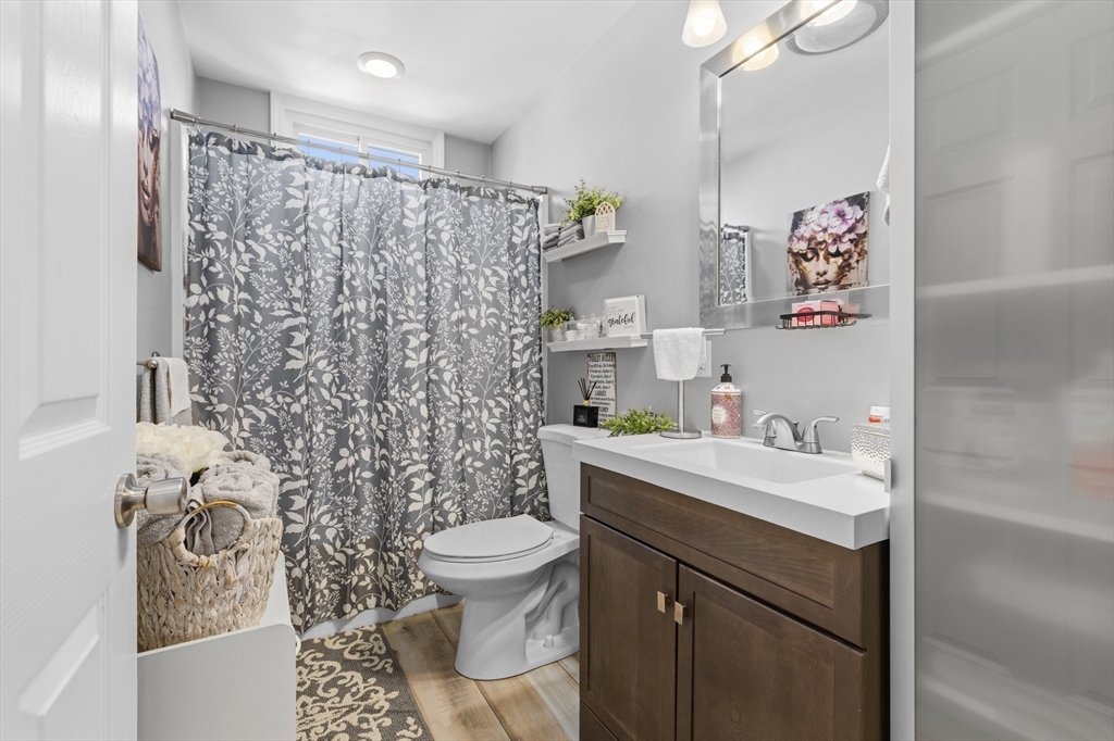 233 Belleville Road New Bedford, MA 02745 - Photo 19 of 40 a bathroom with a sink toilet and shower