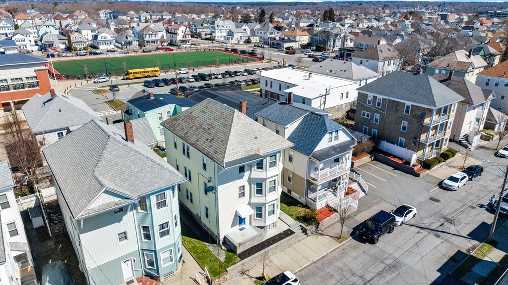 233 Belleville Road New Bedford, MA 02745 - Photo 2 of 40 an aerial view of a residential apartment building with a yard