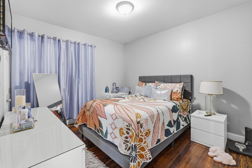 233 Belleville Road New Bedford, MA 02745 - Photo 22 of 40 a bedroom with a bed and a mirror