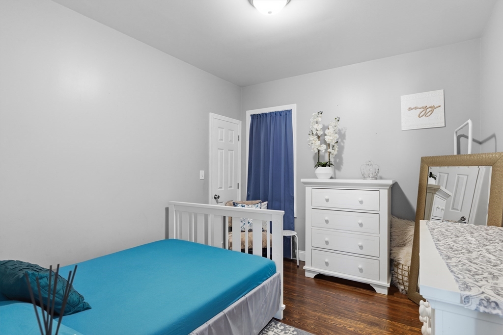 233 Belleville Road New Bedford, MA 02745 - Photo 23 of 40 a bedroom with a bed and furniture