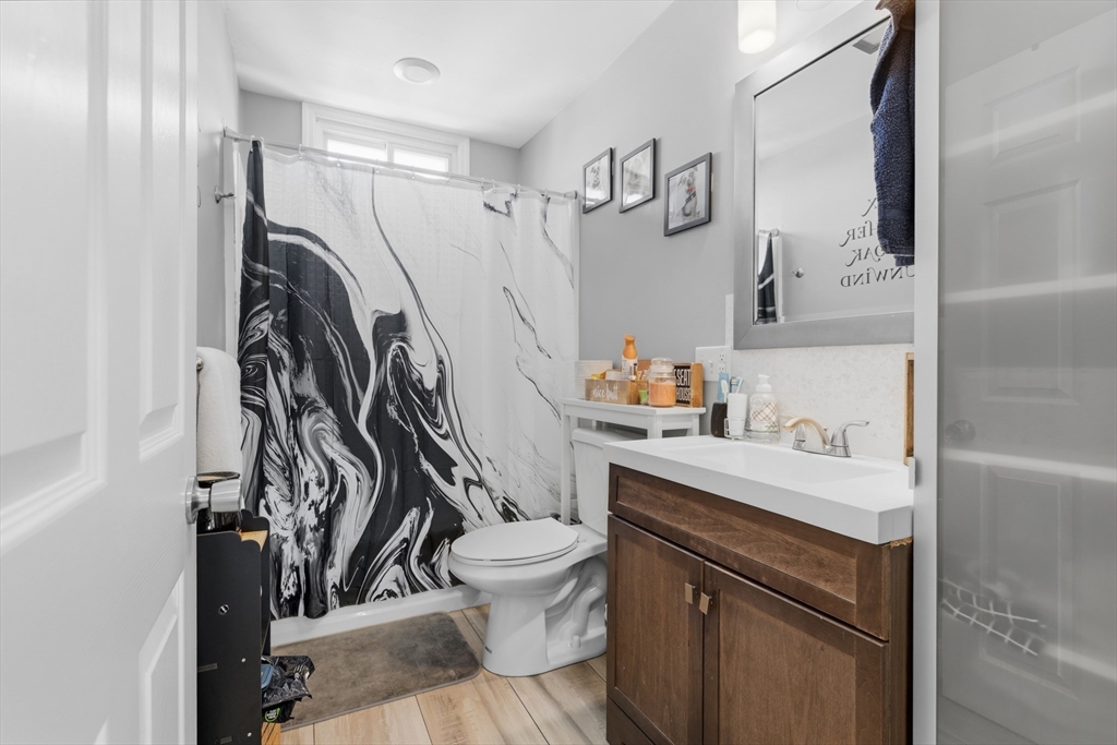 233 Belleville Road New Bedford, MA 02745 - Photo 28 of 40 a bathroom with a sink toilet and shower