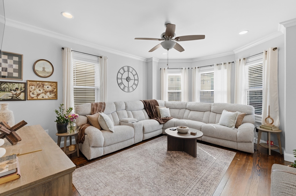233 Belleville Road New Bedford, MA 02745 - Photo 3 of 40 a living room with furniture a clock and a window