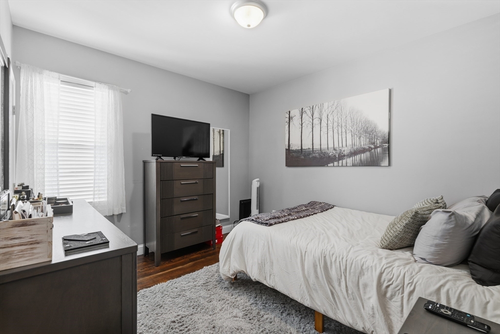 233 Belleville Road New Bedford, MA 02745 - Photo 31 of 40 a bedroom with a bed and a television