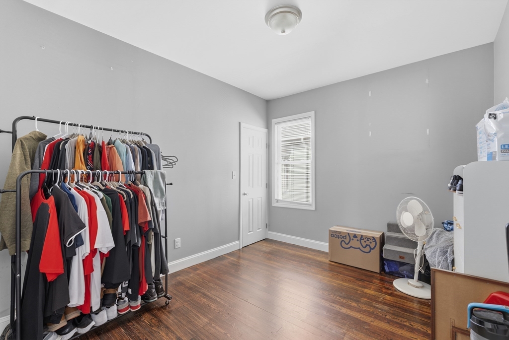233 Belleville Road New Bedford, MA 02745 - Photo 33 of 40 a view of walk in closet with clothes and shoes