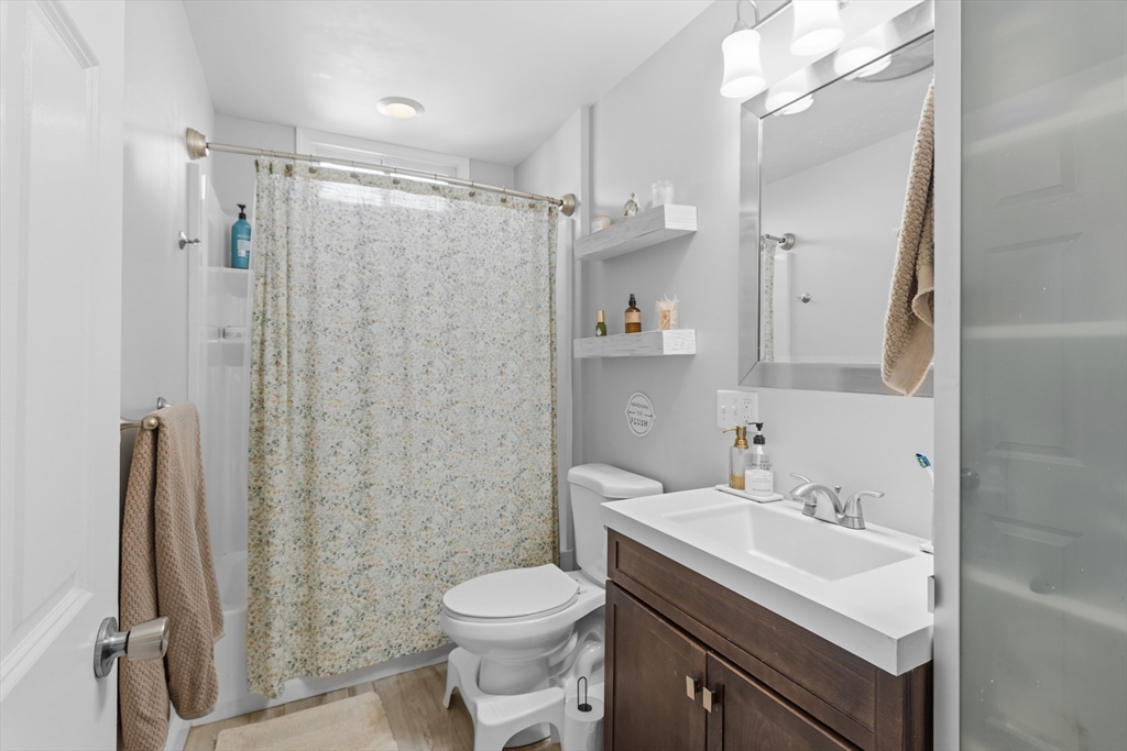 233 Belleville Road New Bedford, MA 02745 - Photo 5 of 40 a bathroom with a sink toilet and shower