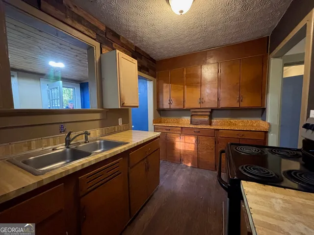 a kitchen with a sink and cabinets