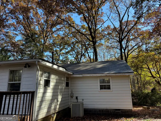 a view of outdoor space with pool and sitting area