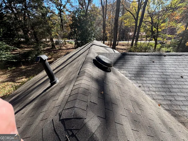 a view of a room with wooden walls