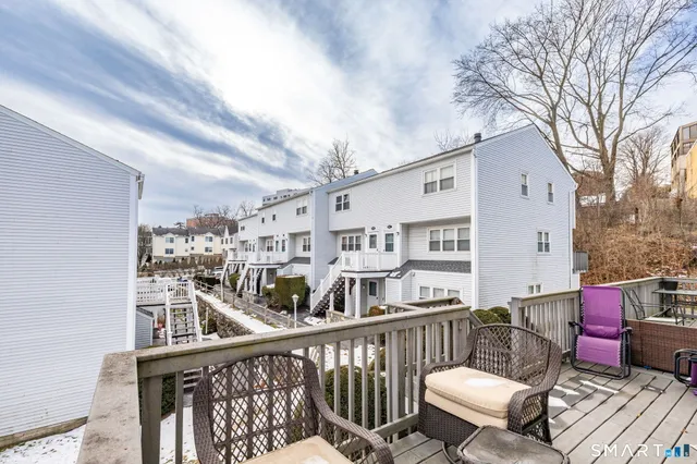 a view of balcony with furniture