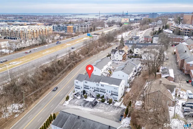 a picture of a bench in front of a wall