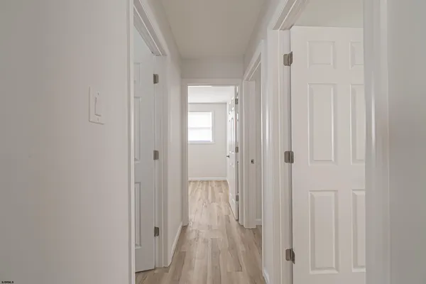 a view of a bathroom from a hallway