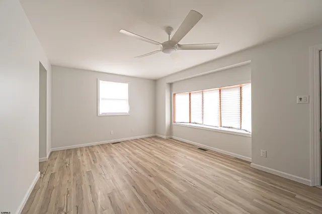 a kitchen with stainless steel appliances granite countertop a stove and a refrigerator