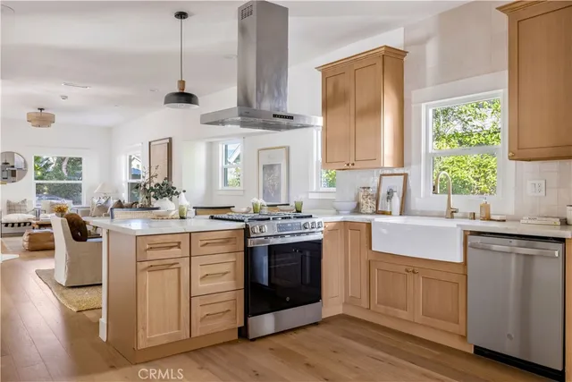 a kitchen with a stove oven and sink