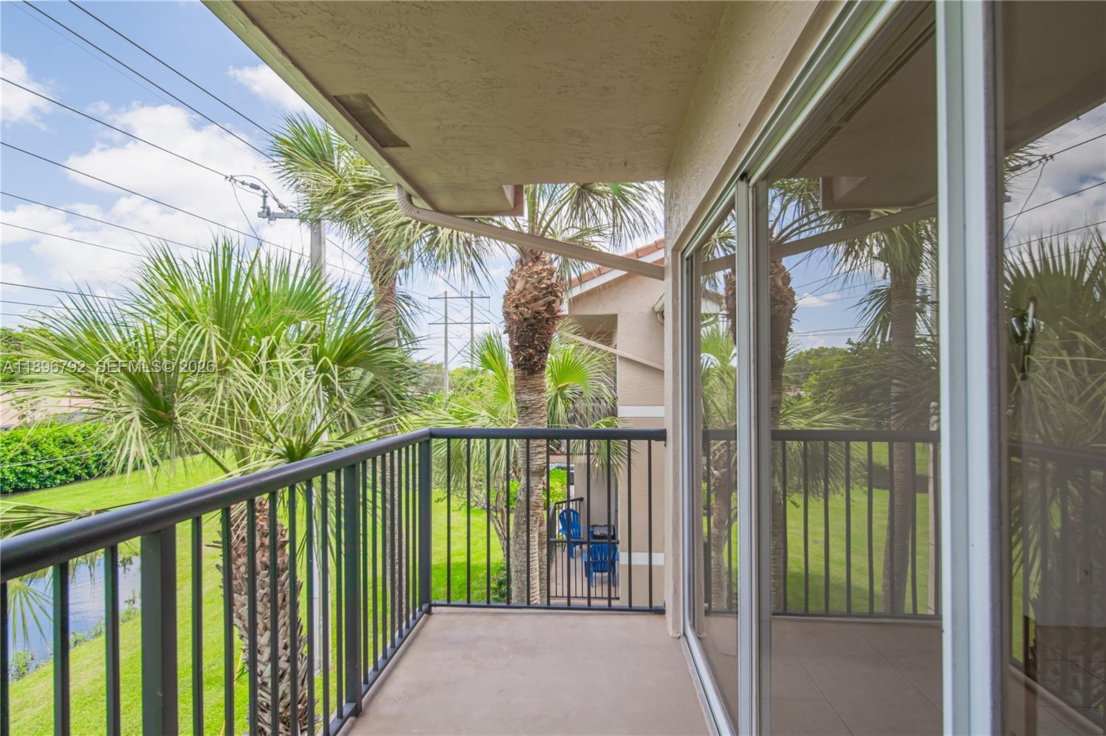 9033 Wiles Road, Unit 303 Coral Springs, FL 33067 - Photo 11 of 17 a view of balcony with wooden floor
