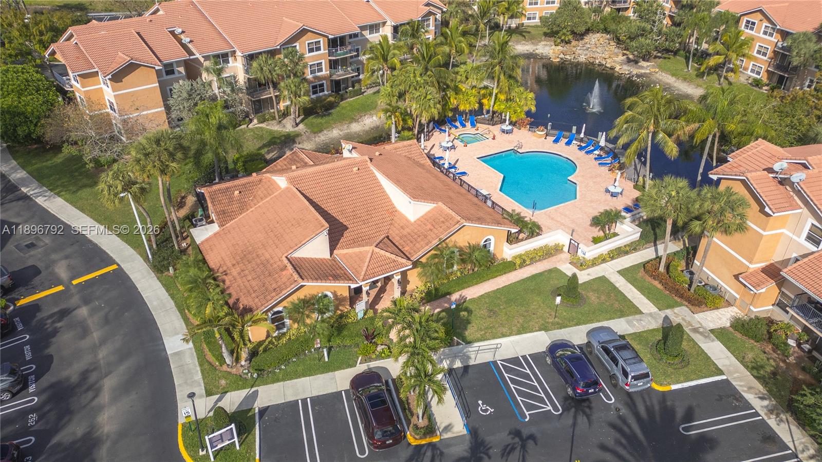 9033 Wiles Road, Unit 303 Coral Springs, FL 33067 - Photo 14 of 17 an aerial view of a house with a swimming pool