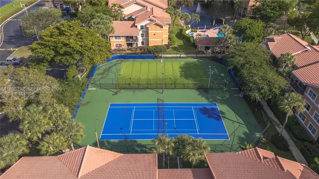 a view of brick house with a yard