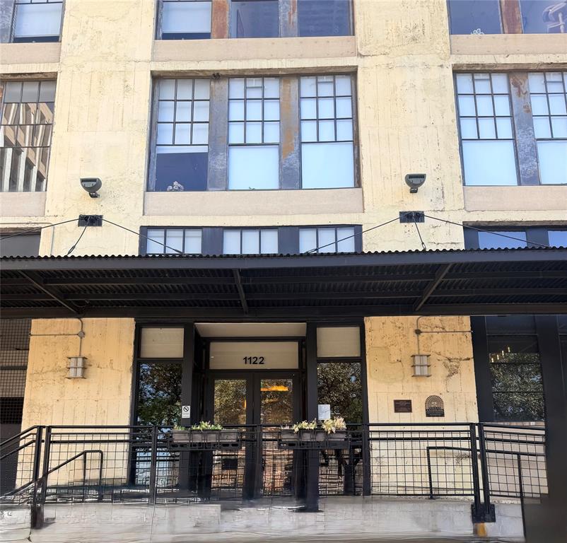 a kitchen with a window and a refrigerator