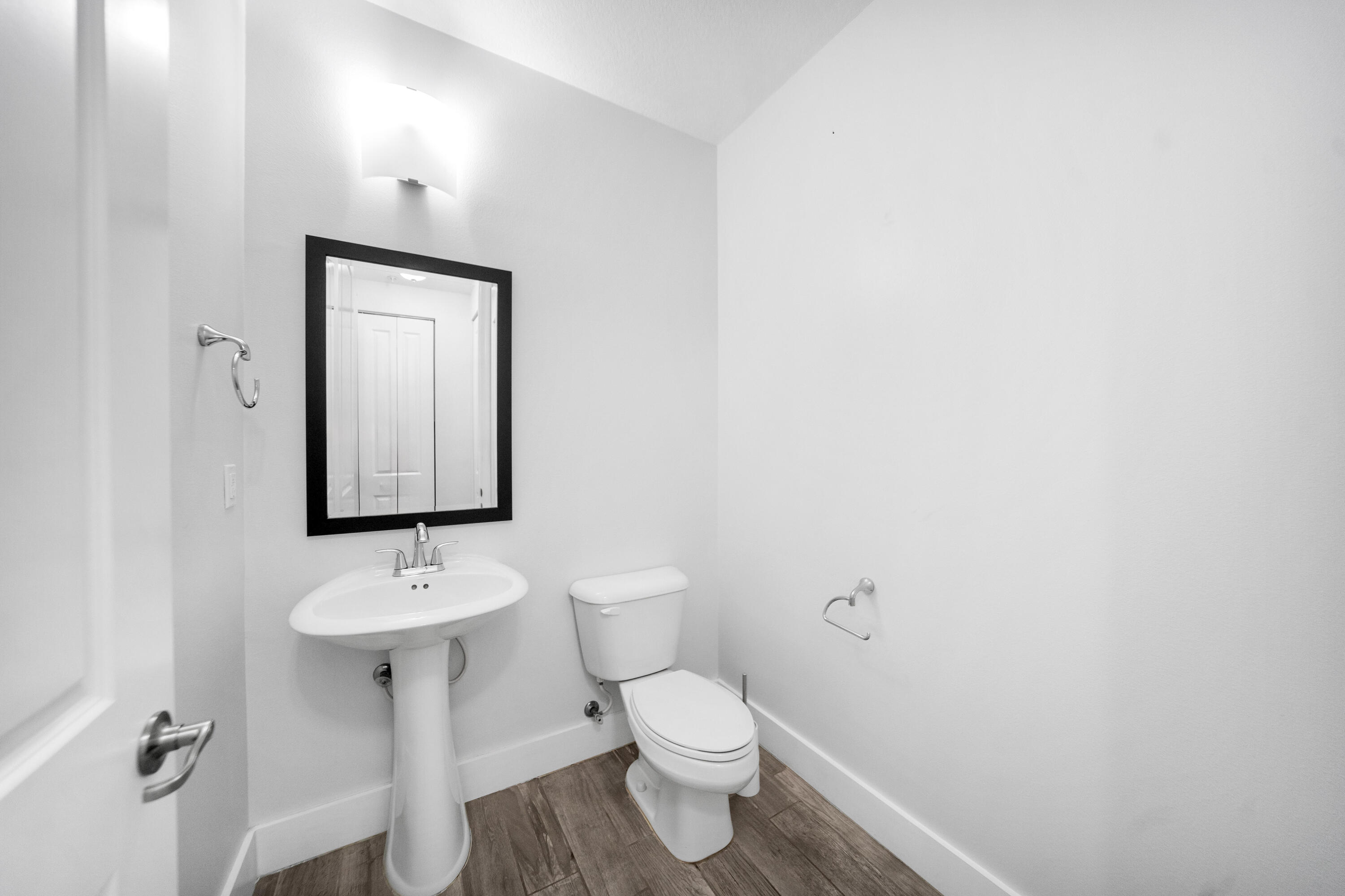 1430 Northwest 48th Lane Boca Raton, FL 33431 - Photo 14 of 54 a bathroom with a toilet sink and mirror