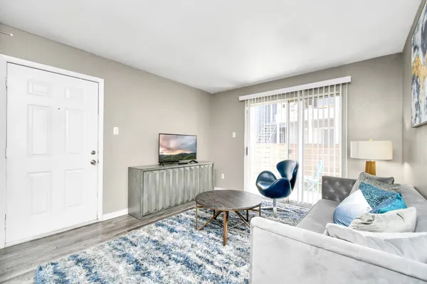 a living room with furniture and a window