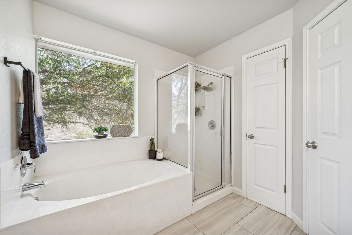 8611 Devine Lane Austin, TX 78748 - Photo 27 of 33 a white bath tub sitting next to a window