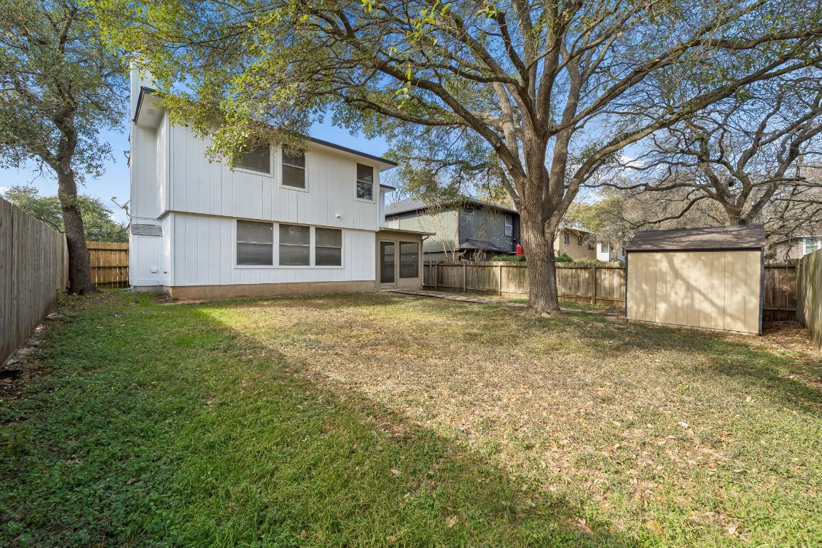 8611 Devine Lane Austin, TX 78748 - Photo 32 of 33 a front view of a house with a yard covered with trees
