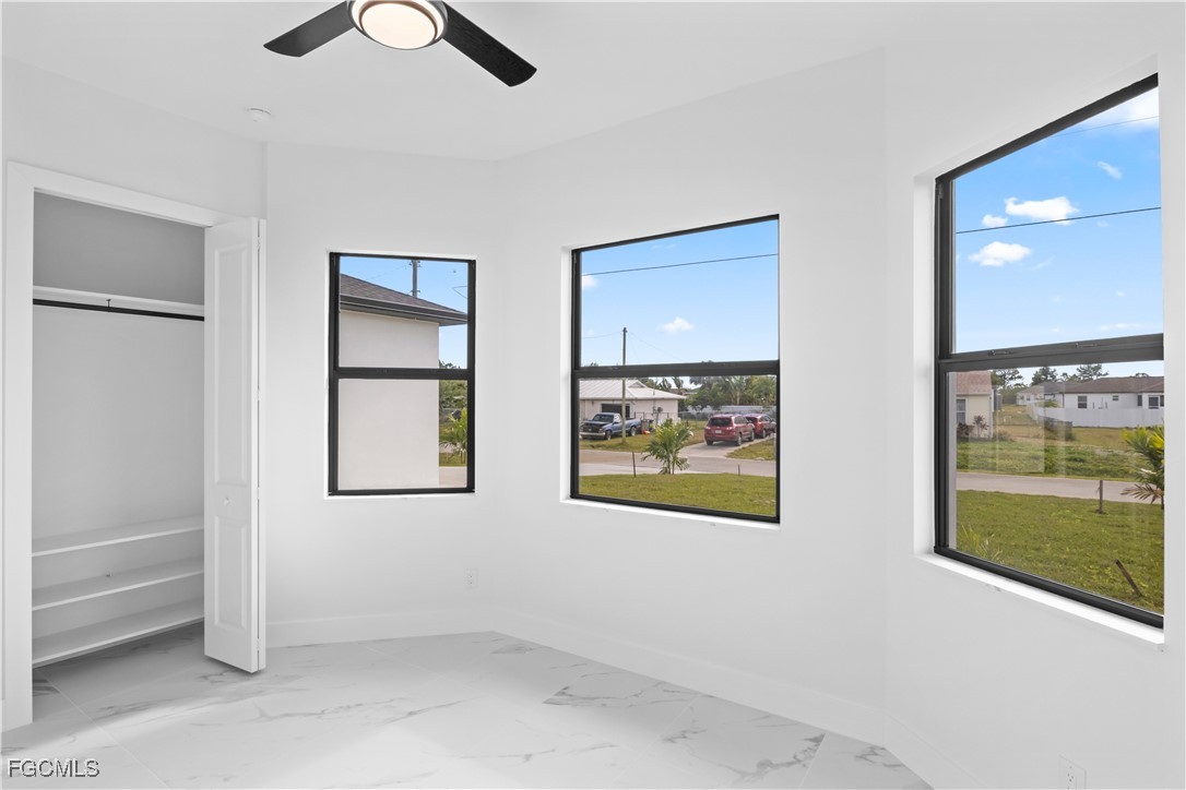 4006 5th Street Southwest Lehigh Acres, FL 33976 - Photo 23 of 32 a view of room with window and cabinet