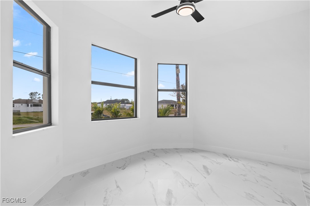 4006 5th Street Southwest Lehigh Acres, FL 33976 - Photo 24 of 32 an empty room with windows