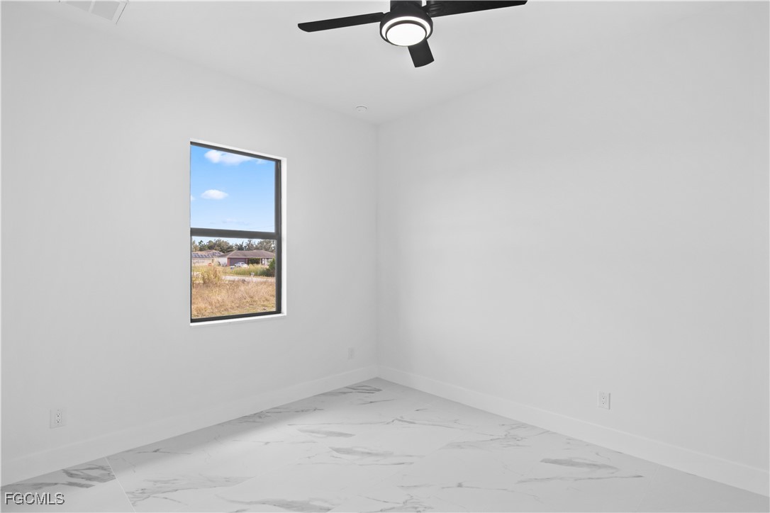 4006 5th Street Southwest Lehigh Acres, FL 33976 - Photo 26 of 32 an empty room with a window