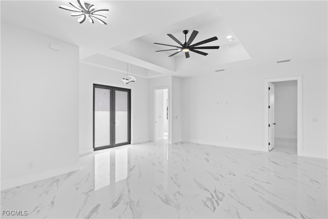 4006 5th Street Southwest Lehigh Acres, FL 33976 - Photo 29 of 32 a view of a room with a ceiling fan and a window