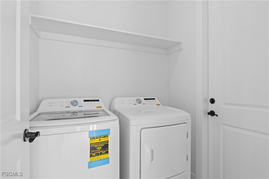 4006 5th Street Southwest Lehigh Acres, FL 33976 - Photo 31 of 32 a utility room with dryer and washer