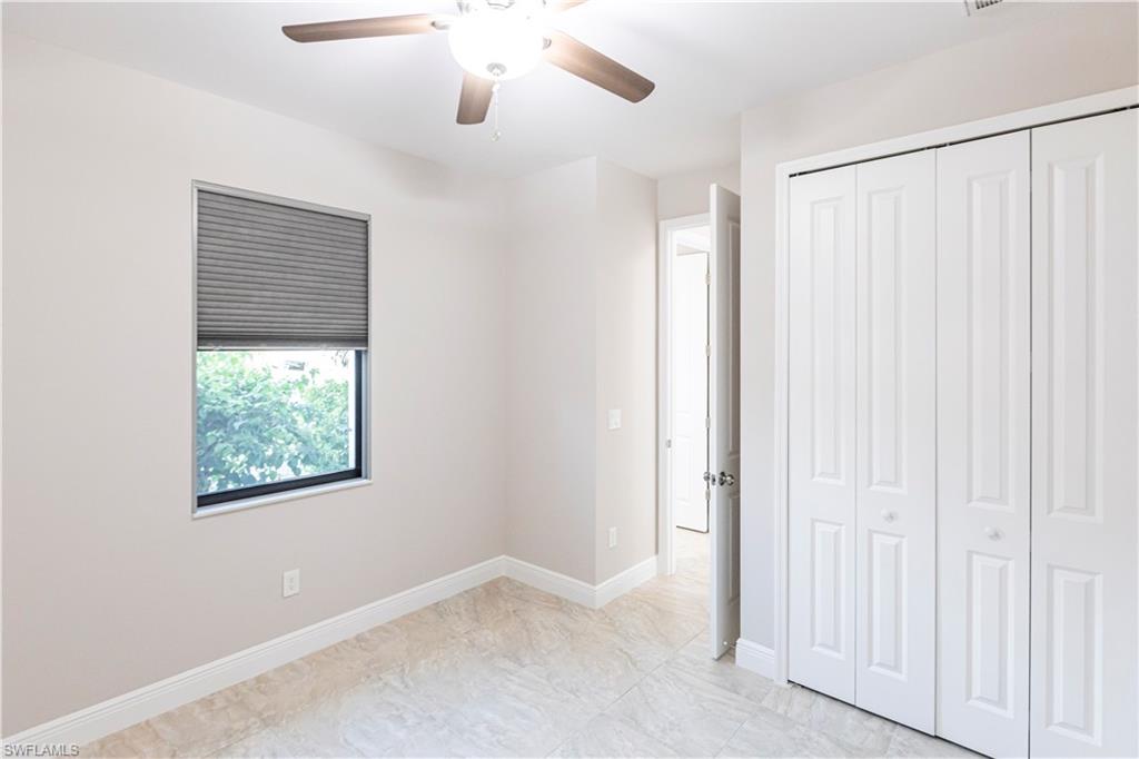 18580 Sarasota Road Fort Myers, FL 33967 - Photo 33 of 44 an empty room with windows and closet