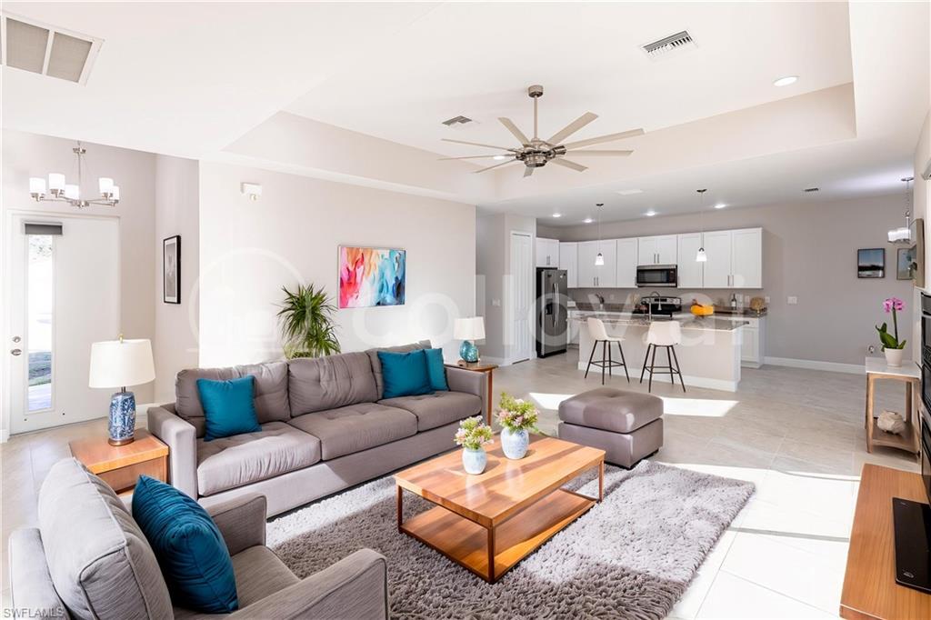 18580 Sarasota Road Fort Myers, FL 33967 - Photo 10 of 44 a living room with furniture kitchen view and a chandelier