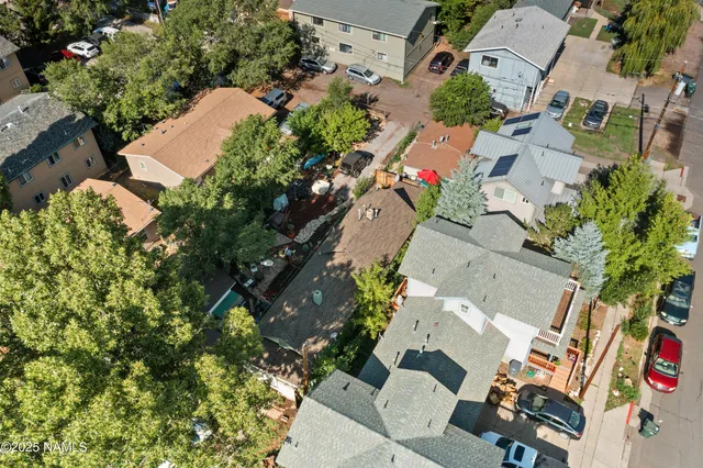 an aerial view of residential houses with outdoor space