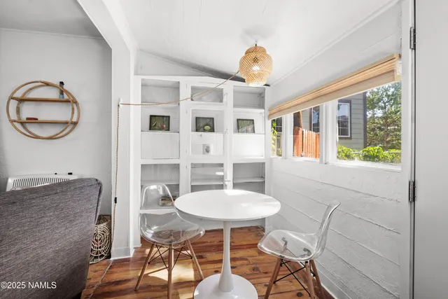 a front view of a house with table and chairs