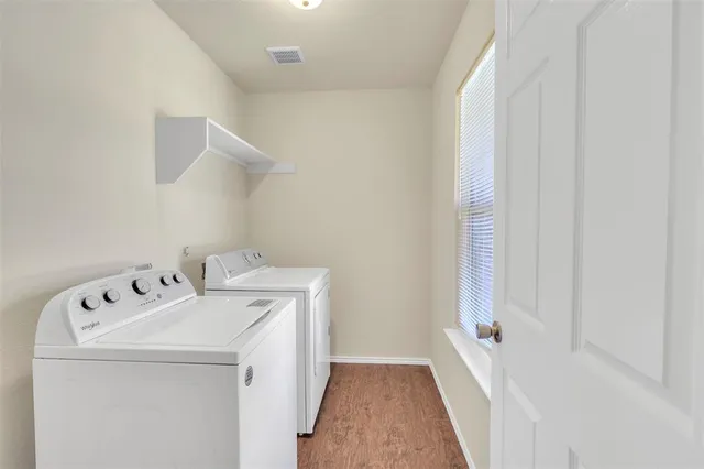 a utility room with dryer and washer