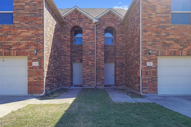 front view of a house with a garden