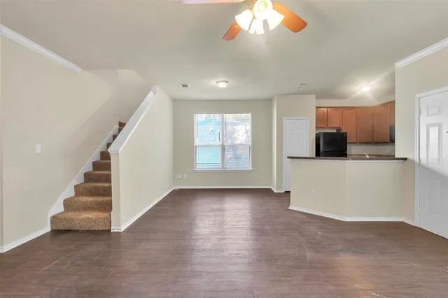 a view of a kitchen with a sink and a window