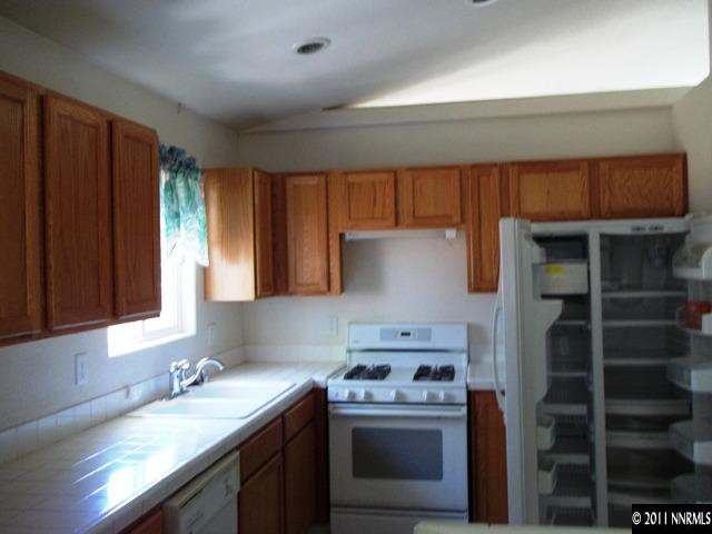 391 B Bens Way Fernley, NV 89408 - Photo 3 of 10 a kitchen with a stove and a sink
