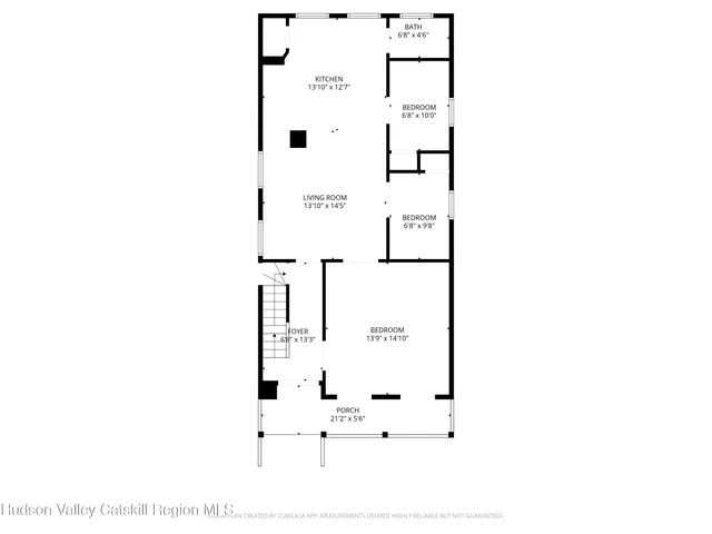 a picture of a bench in front of a wall