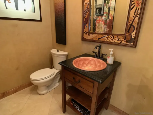 a living room with furniture and a fireplace or television