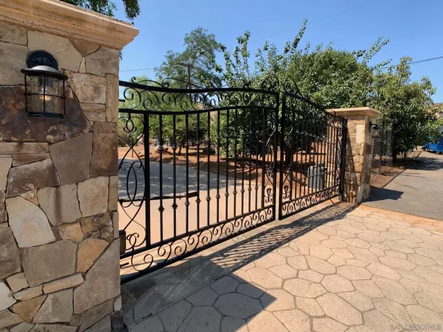 a view of a wrought iron fences in front of house