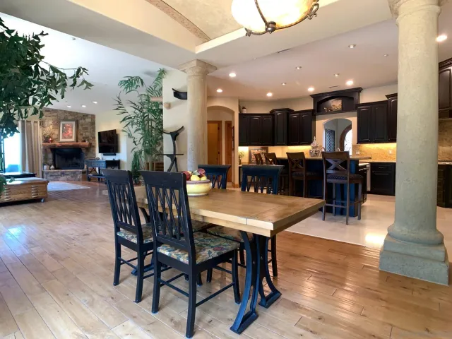 a bathroom with a granite countertop sink a toilet a mirror and shower