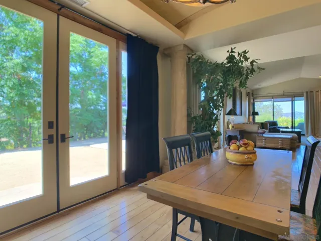 a bathroom with a granite countertop sink a mirror and shower