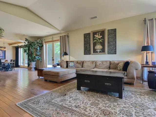 a kitchen with stainless steel appliances granite countertop a stove and a refrigerator