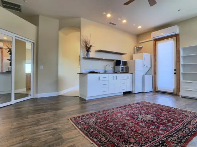 a backyard of a house with table and chairs