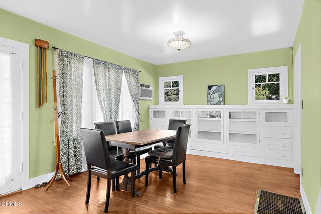 a view of a dining room with furniture and window