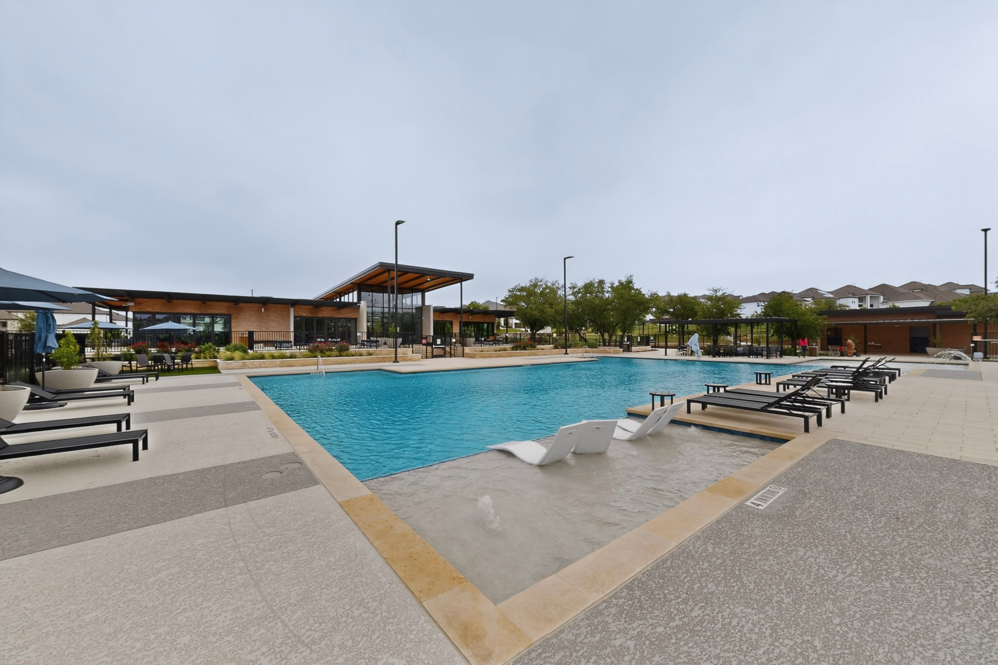 2308 Mondello Path Leander, TX 78641 - Photo 35 of 39 A refreshing aquatic oasis with a stylish clubhouse provides leisure for all.